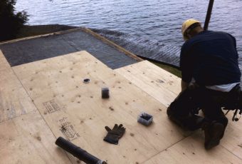Boathouse deck getting treated with new plywood
