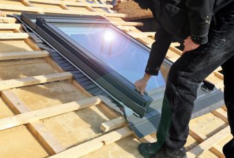 worker installing a skylight